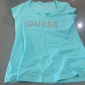 Guess fitted t-shirt bling and a light turquoise color size large.